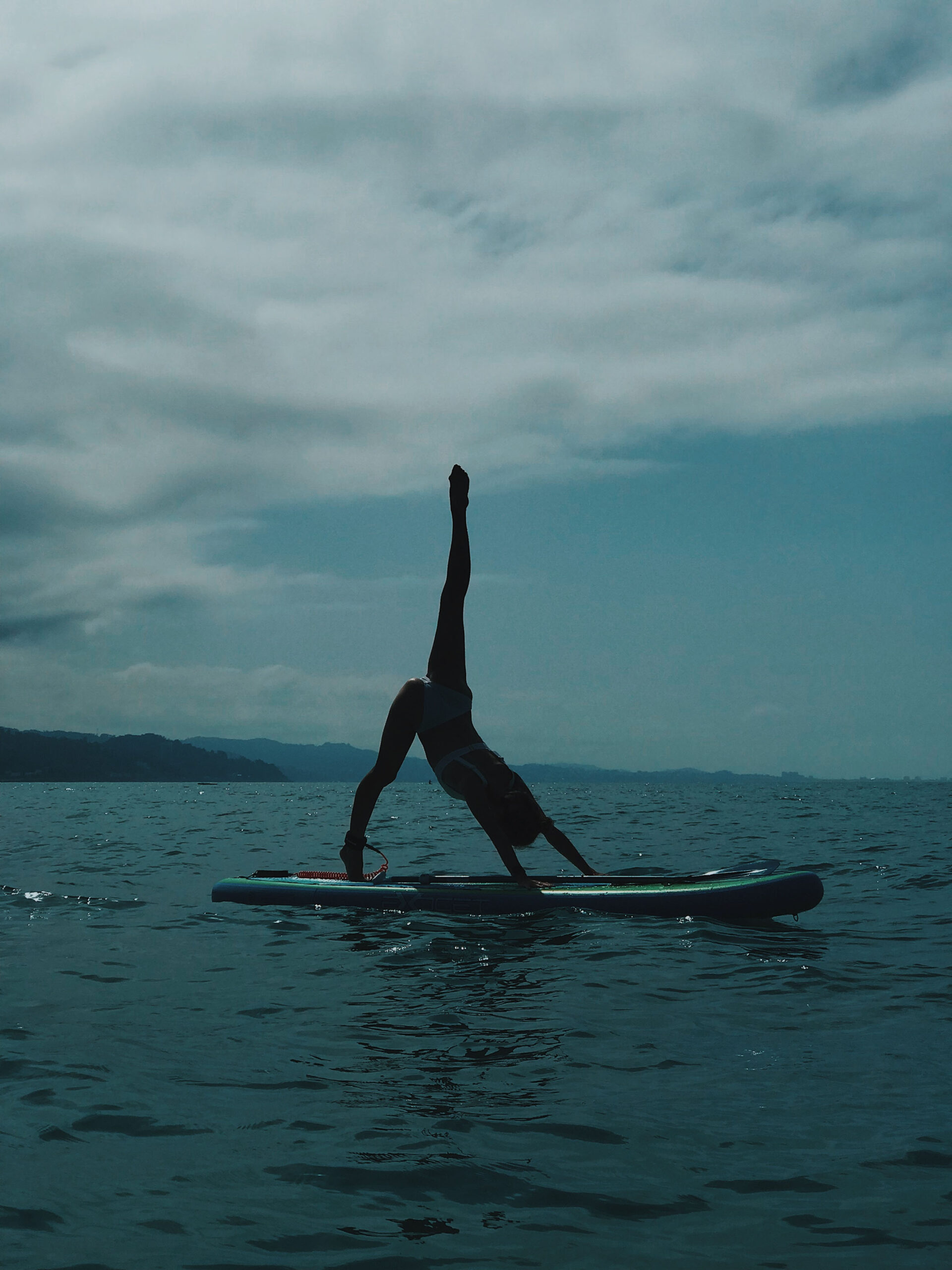 Woman standing on a paddle board